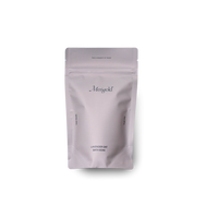 Merigold Lavender Oat Bath Soak is in a lavender resealable bag with a minimalist design, highlighting ingredients like organic oats, lavender flowers, and Epsom salt. Photographed on white background.