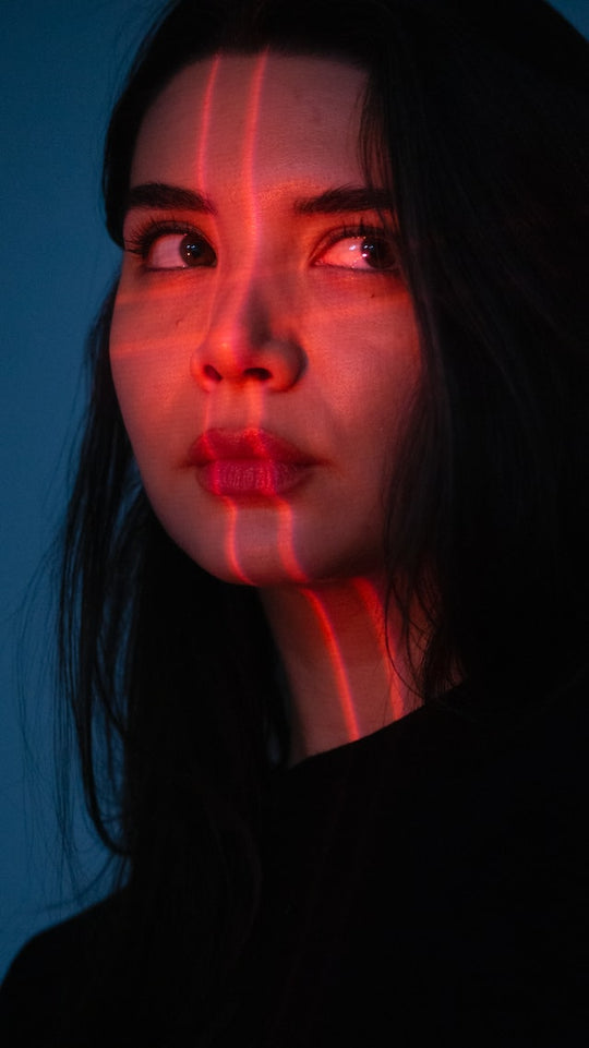 Women with red light lines on face