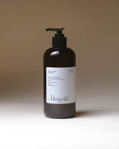 Merigold Mindful Citrus Body Wash in amber pump bottle, bright citrus-infused clean skincare for daily cleansing.