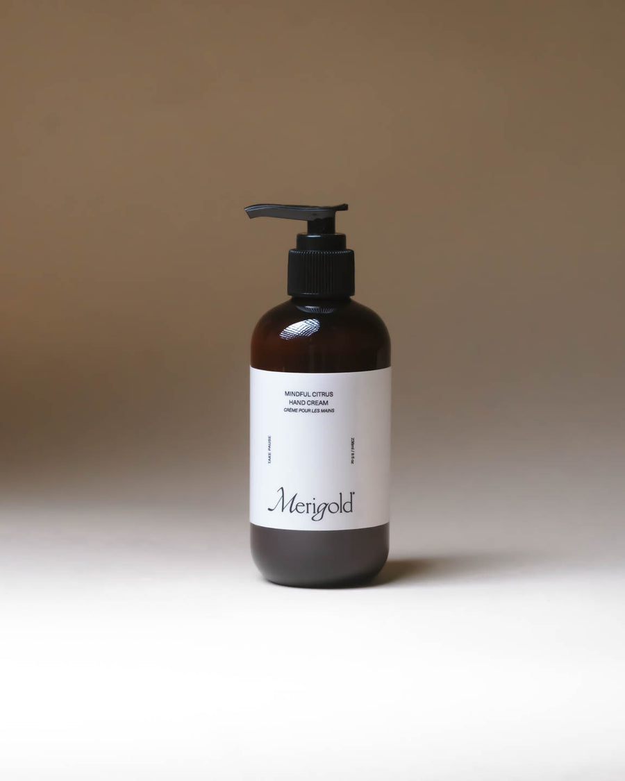 Merigold Mindful Citrus Hand Cream in amber pump bottle, refreshing citrus everyday hand moisturizer.