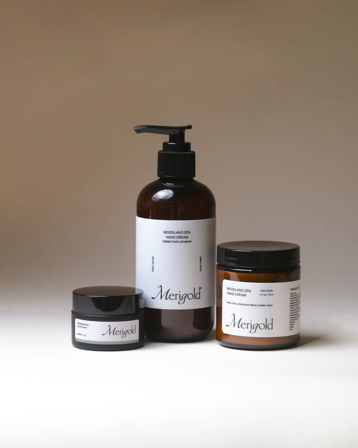 Merigold Woodland Zen Hand Cream in amber jar on neutral backdrop, grounding botanical hand cream with soft white texture.