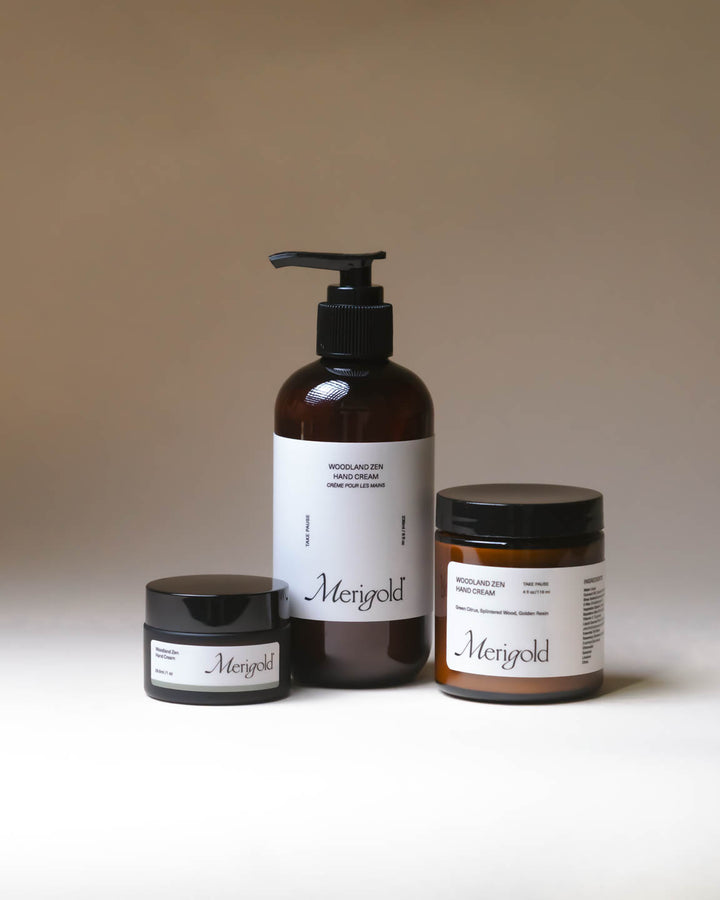 Merigold Woodland Zen Hand Cream in amber jar on neutral backdrop, grounding botanical hand cream with soft white texture.