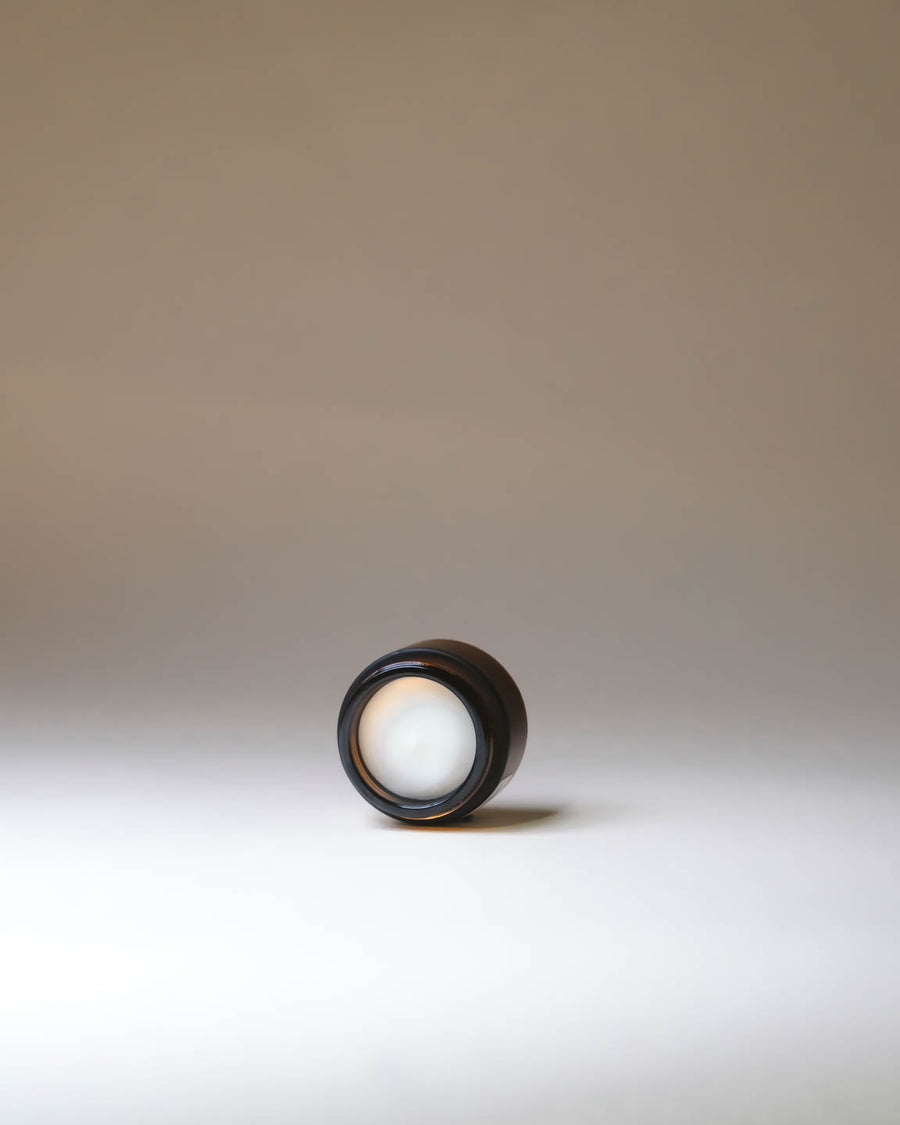 Merigold Woodland Zen Hand Cream in amber jars with creamy texture visible, grounding botanical hand moisturizer.