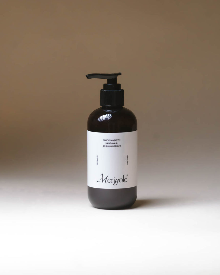 Merigold Woodland Zen Hand Soap in amber pump bottle on minimal backdrop, natural aromatic hand wash.
