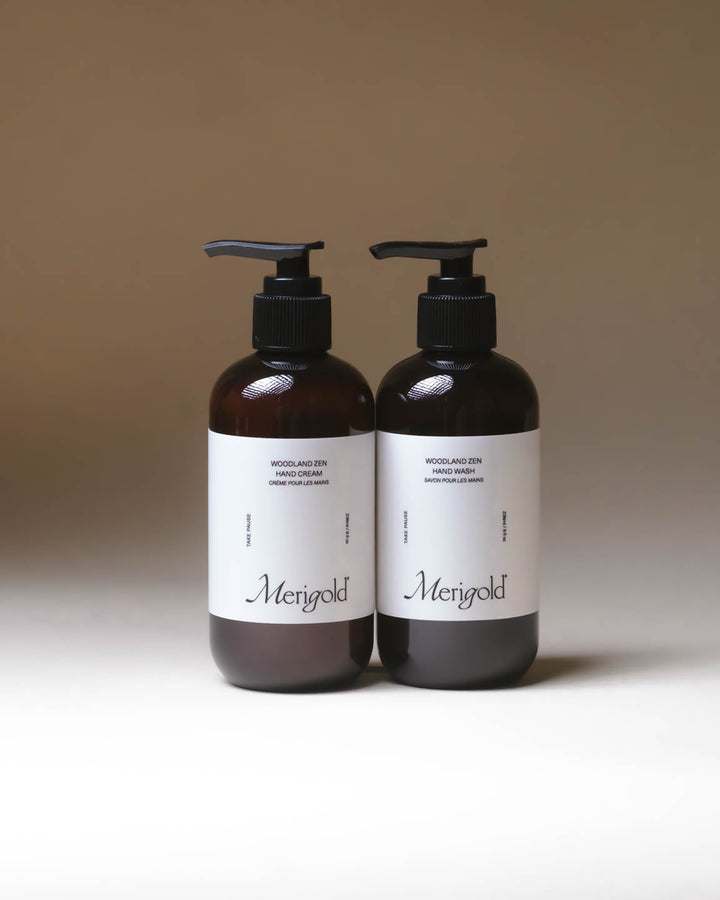 Merigold Woodland Zen Hand Soap and Hand Cream bundle in amber bottles on minimal backdrop, grounding clean skincare set.