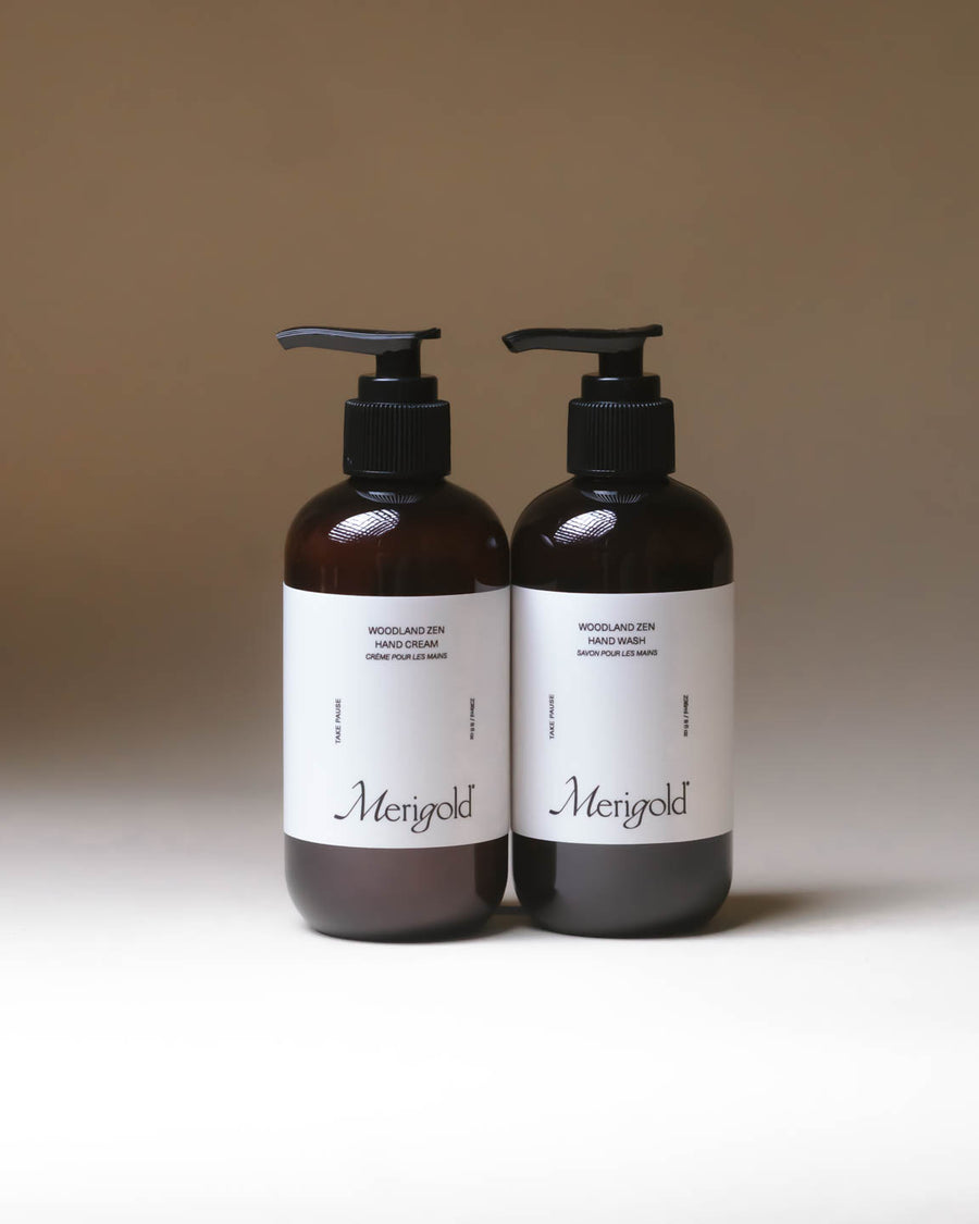 Merigold Woodland Zen Hand Soap and Hand Cream bundle in amber bottles on minimal backdrop, grounding clean skincare set.