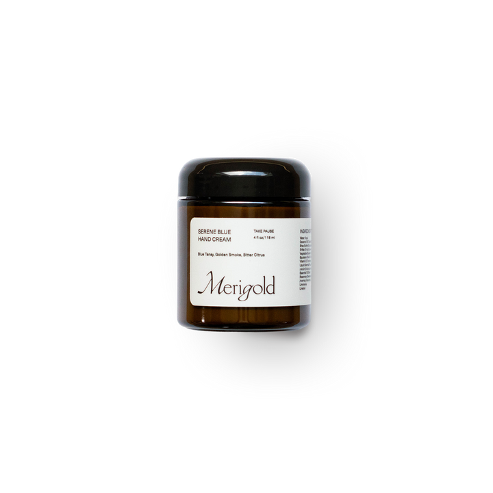 Merigold Serene Blue Hand Cream in amber glass jar with black lid – clean, plant-based moisturizer for dry hands featuring blue tansy and essential oils.